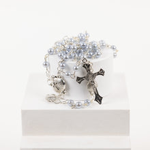 Load image into Gallery viewer, A blue rosary beads with a silver cross and clam shell details.