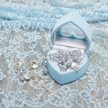 Load image into Gallery viewer, A blue heart shaped rosary with a blue and silver rosary beads on a blue lace.