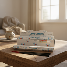 Load image into Gallery viewer, Packaging and incense sticks for &#39;Love Angel&#39;, with romantic rose scent, displaying the product name and angel graphics.
